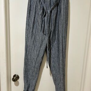 Grey pants with light blue and white pin stripe.